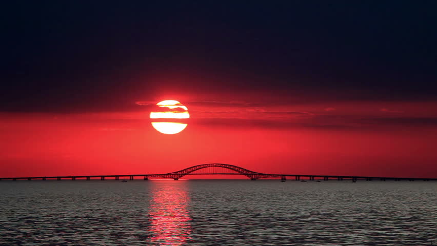 Big Red Sun Setting Over Bridge With Boat Stock Footage Video 950101 ...